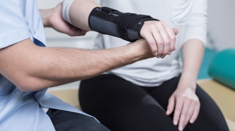 Woman using wrist immobiliser after hand's injury